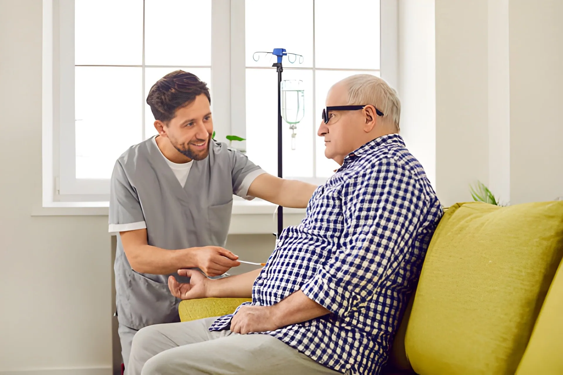 IV therapy session in Port St. Lucie with a healthcare professional administering treatment to a senior patient in a comfortable setting