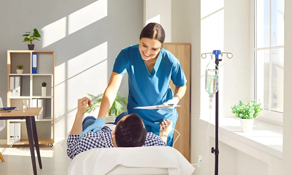 Medical professional in Port St. Lucie providing IV therapy to a patient in a bright, welcoming clinical environment