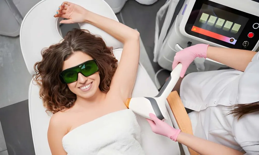 Laser aesthetics near me—professional performing armpit hair removal with handheld laser device in clinic.