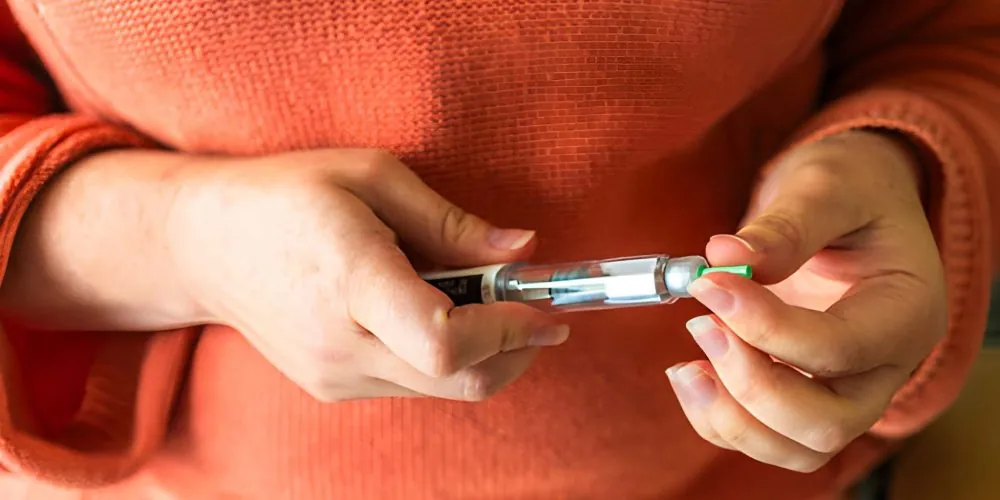 Treasure Coast weight loss program showing insulin pen technique and medical weight management